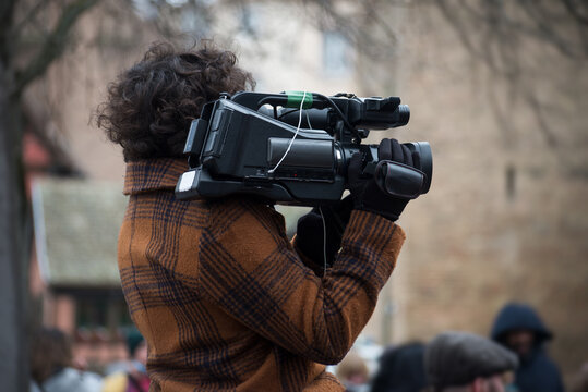Portrait of cameraman standing in the street