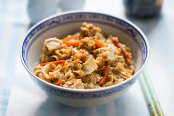 Pad Thai with tofu. Thai dish with rice noodles, carrots and peanuts