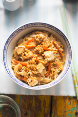 Fototapeta premium Pad Thai with tofu. Thai dish with rice noodles, carrots and peanuts