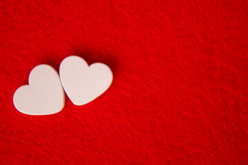 Hearts on a red background. Valentine's Day. Selective focus.