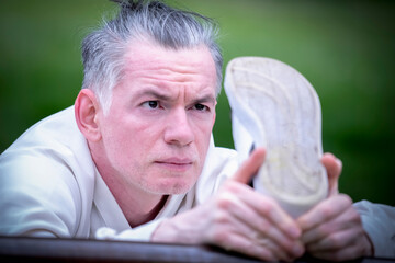 Kung Fu training.  Male athlete performs daily physical exercises.