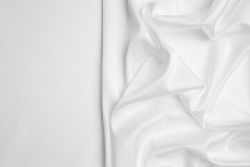 Texture of delicate fabric on white background, top view