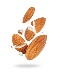 Cracked almonds close-up in the air on a white background