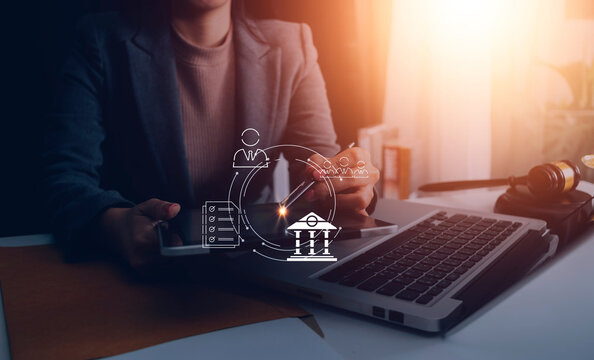 Judge gavel with Justice lawyers having team meeting at law firm in background. Concepts of law.