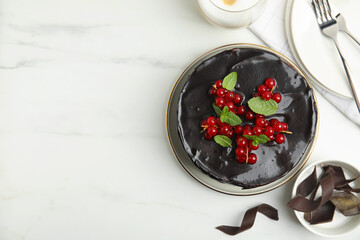 Tasty homemade chocolate cake with berries and mint on white marble table, flat lay. Space for text