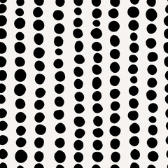 Vertical lined spots seamless repeat pattern. Irregular, vector polka dots in row all over surface print on white background.