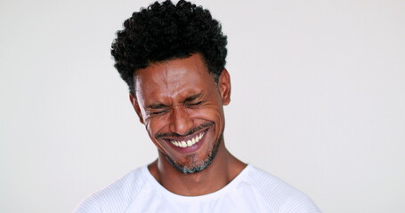 Happy black African man smiling and laughing portrait, charismatic man