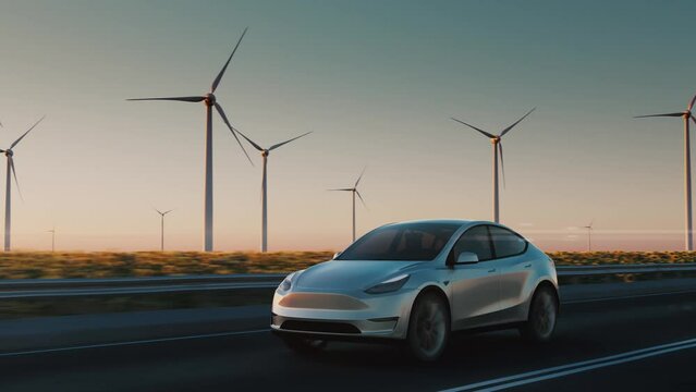 An electric car drives along the road against the backdrop of Wind power plants. Sunset. Clean renewable energy technologies. Green energy recovery concept