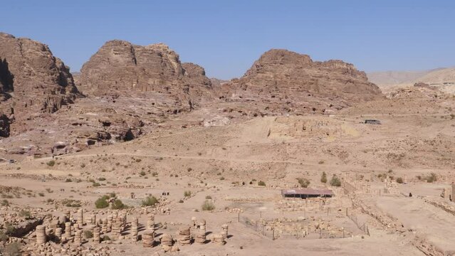 Panoramic view of Petra archeological park UNESCO world heritage. Dry mountains rocky landscape and old ancient ruins during sunny hot day