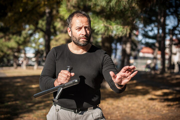 Instructor demonstrates fighting, apprehension and arrest techniques using rubber baton
