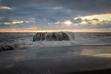 rock in the storm in the sea