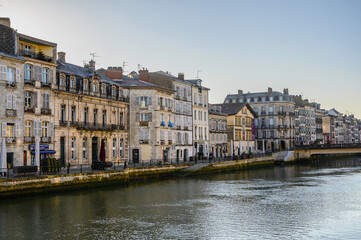 photography of petit bayonne from the quai Amiral Lespes we can see the river Nive and the buildings of the quai des Corsaires in the background the pont Marengo. A sunny winter morning with nobody on