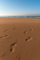 Footprints in the sand on the beach at sunrise, Barbate, Cadiz, Andalusia, Spain