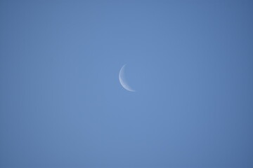Obraz na płótnie Canvas Moon Sliver in Blue Sky