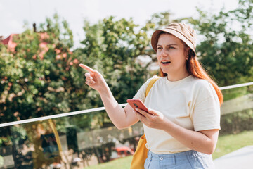 Woman hand using smartphone with gps navigator map. Technology lifestyle and travel concept. Young unhappy woman lost in the sity