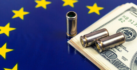 Gun bullets and money over the Europe union flag, banner. Criminal and crime, corruption concept....