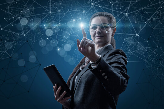 Businesswoman working online on a blue background.