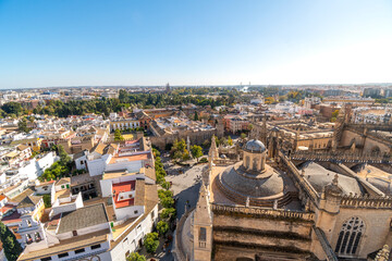 Fototapeta na wymiar View of the Royal Alcazar, Plaza and Barrio Santa Cruz old town area from the Giralda Tower of the Seville Cathedral in Seville, Spain.