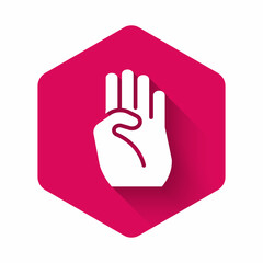 White Indian symbol hand icon isolated with long shadow. Pink hexagon button. Vector
