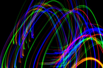 Colorful elliptic thin stripes on a black background.