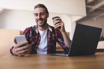 Millennial businessman working at desk in office