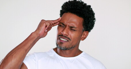 African man having a headache pain and worry