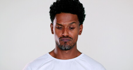 Obraz premium African man feeling regret, black person face portrait stressed out