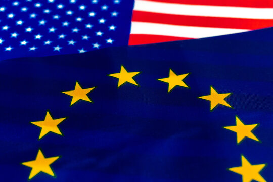 USA vs European Union conflict concept. Flags of United States of America and Europe. Economy and politics photo