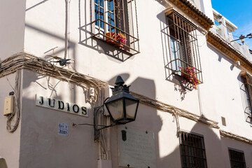 One of the many narrow, public streets marking the Jewish Quarter in the historic Andalusian city of Cordoba, Spain.