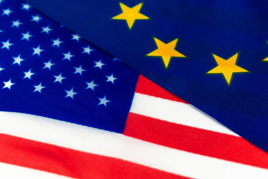 USA vs European Union conflict concept. Flags of United States of America and Europe. Economy and politics photo
