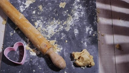 Cookie dough with rolling pin and cookie cutter