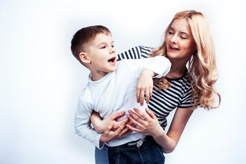 young modern blond mother with cute son together happy smiling family posing cheerful on white background, lifestyle people concept, sister and brother friends
