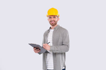 Man Construction Worker Writing in Clipboard Watching in Camera Isolated. Man Builder Working with Clipboard. Commecial, Shopping, Advertisment Concept