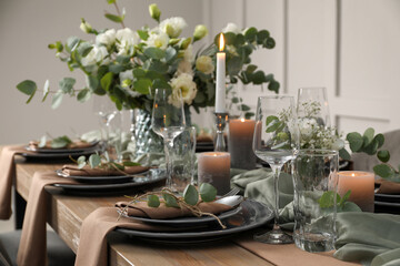 Festive table setting with beautiful floral decor indoors