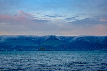 sea and  fog mountains