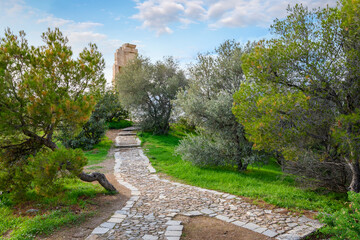 View of the Philopappos Monument from the hilly path to the top of Philopappos or Filopappou Hill in Athens, Greece.