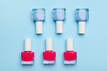 Set of nail polish bottles on color background