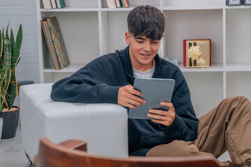 young teenager with digital tablet or e-book at home