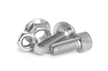 Different metal bolts and nuts on white background
