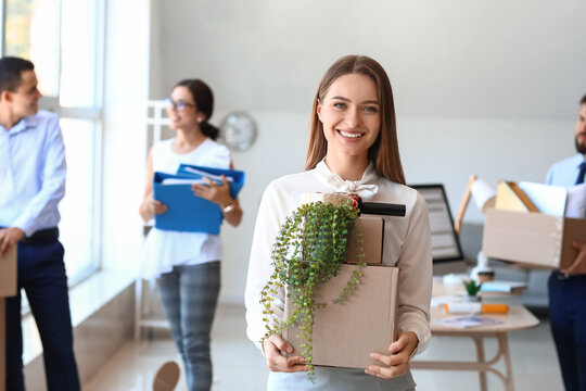 Beautiful Woman Holding Boxes With Things In Office On Moving Day