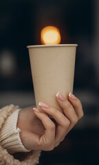 Woman hand with holding coffee cup. Coffee cups