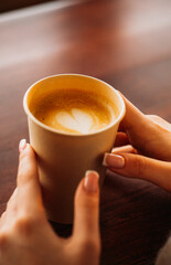 person holding a cup of coffee