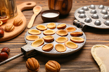 Walnut cookie mold maker on wooden background