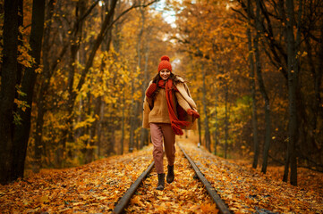 Woman walking in autumn forest