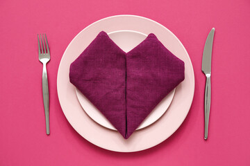 Stylish table setting on pink background