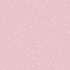 Seamless pattern of repeating dots of different sizes on a pink background. Suitable for wrapping paper, various textiles, and as a background for printing.