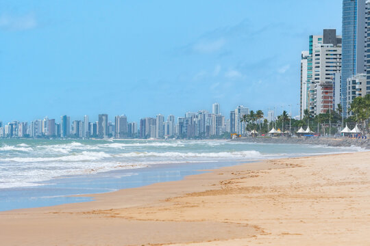 Beautiful beach of the brazilian northeast, view to the beach and the city buildings on the background. Boa Viagem beach in Recife, PE, Brazil.