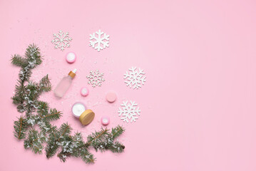 Beautiful winter composition with cosmetic products and snowflakes on color background