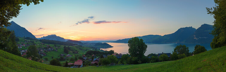 Fototapeta na wymiar dreamy sunset scenery tourist resort Krattigen, lake Thunersee, view from lookout point Buel
