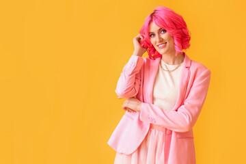 Stylish woman with bright hair on color background